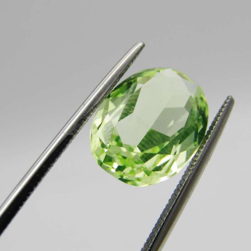 Lab grown Spinel of 5,936 carat - oval mixed cut - Medium dark toned yellowish green