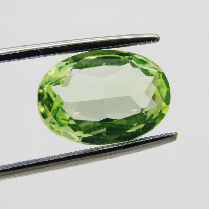 Lab grown Spinel of 5,936 carat - oval mixed cut - Medium dark toned yellowish green