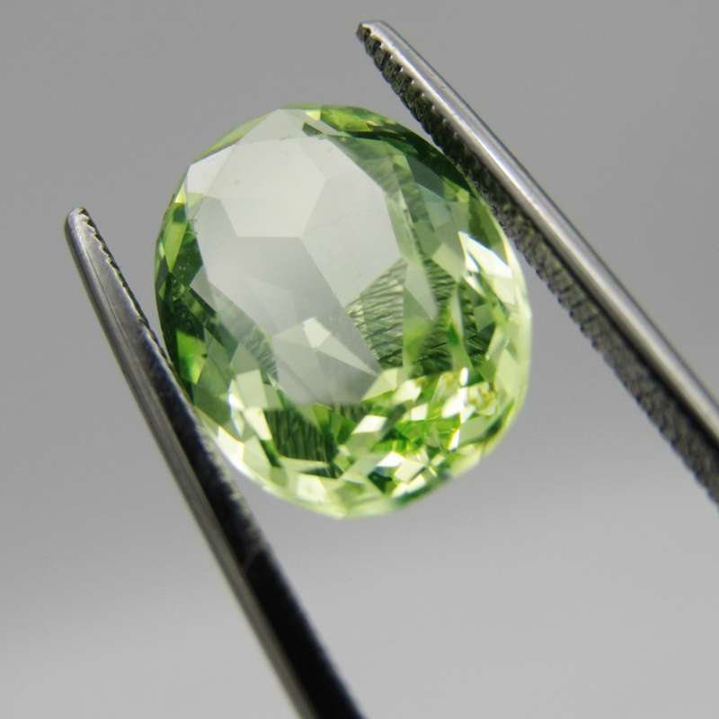 Lab grown Spinel of 5,936 carat - oval mixed cut - Medium dark toned yellowish green