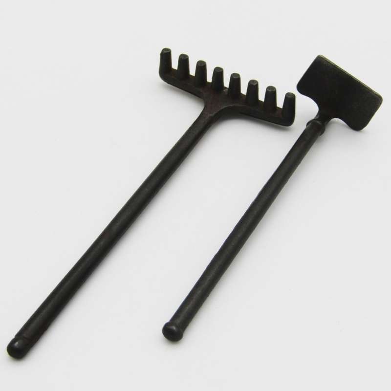 Antique miniature cast iron rake and garden hoe