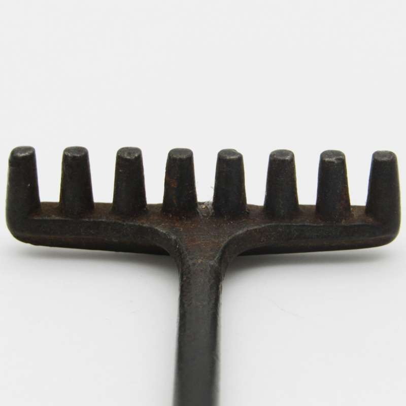 Antique miniature cast iron rake and garden hoe