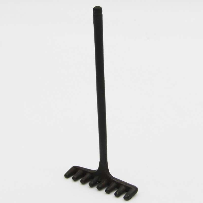 Antique miniature cast iron rake and garden hoe