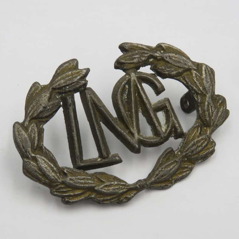 Light Machine gunner lead cast badge- wreath broken in centre