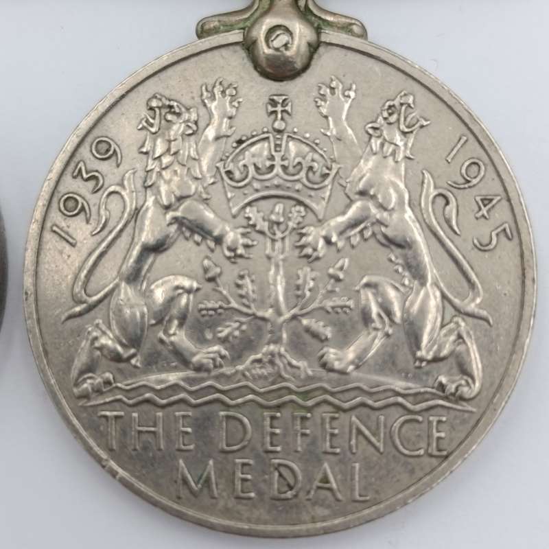 Pair of WW2 medals issued to C169528 T Paulsen - Africa service medal and WW2 Defence medal