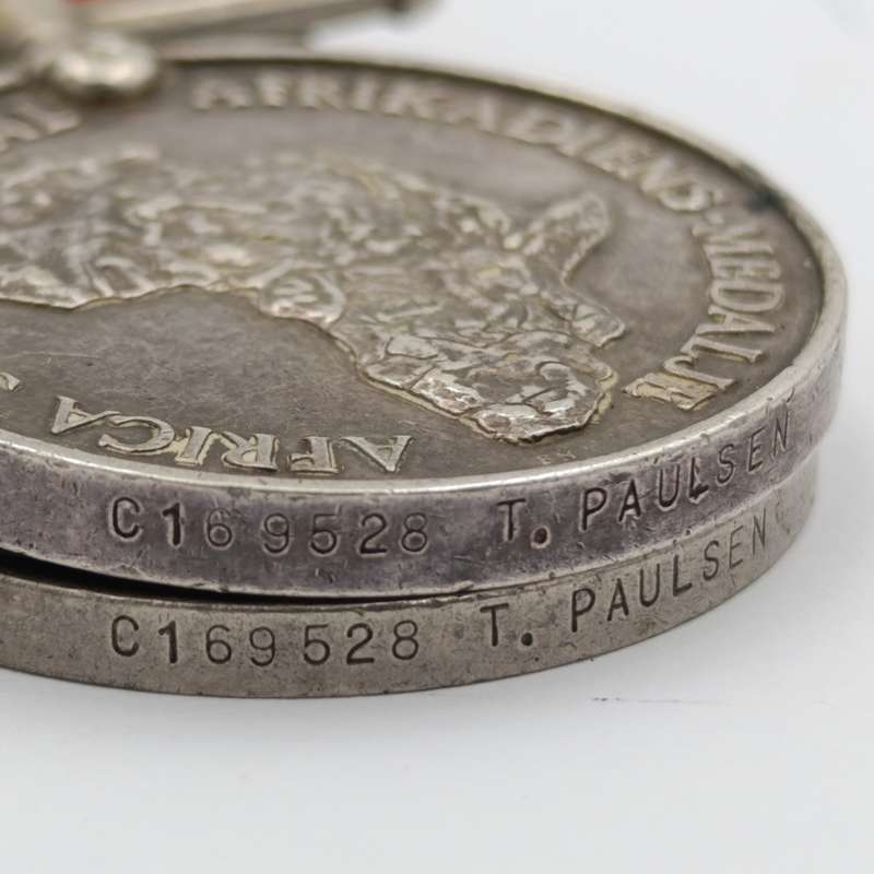 Pair of WW2 medals issued to C169528 T Paulsen - Africa service medal and WW2 Defence medal