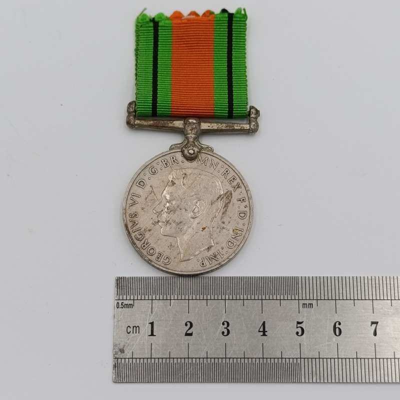 Pair of WW2 medals issued to C169528 T Paulsen - Africa service medal and WW2 Defence medal