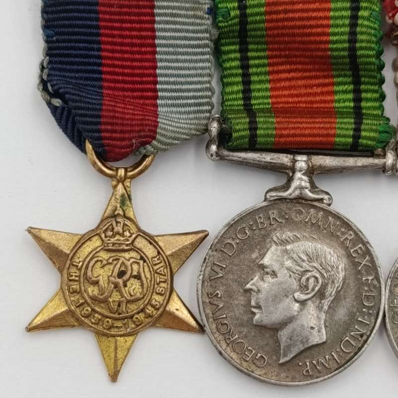 Set of 4 WW2 miniature medals with mentioned in despatched oak leaf