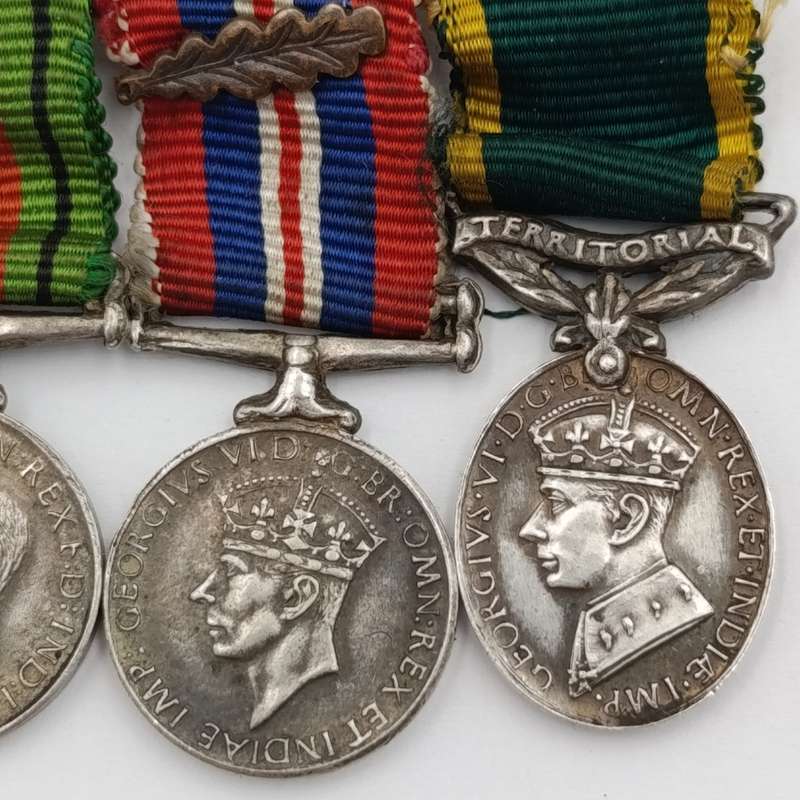 Set of 4 WW2 miniature medals with mentioned in despatched oak leaf