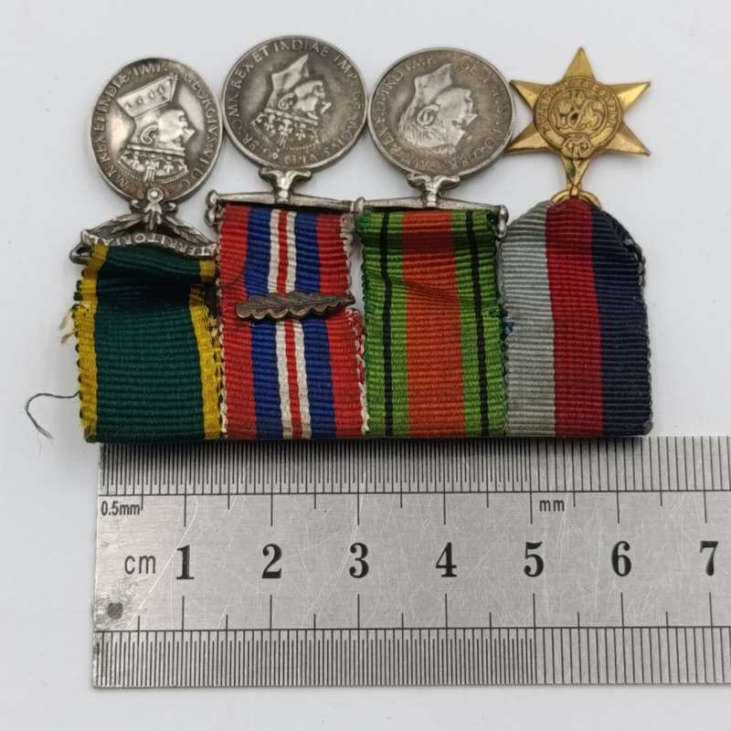 Set of 4 WW2 miniature medals with mentioned in despatched oak leaf