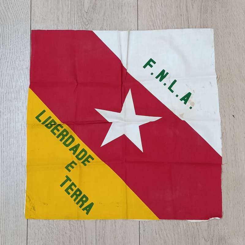 FNLA flag given to reaction force member by one of the original 32 troops