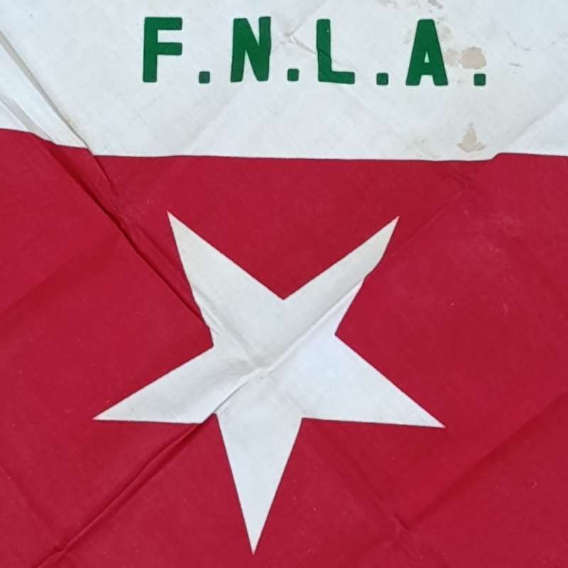 FNLA flag given to reaction force member by one of the original 32 troops