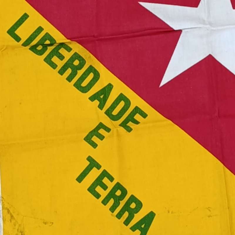 FNLA flag given to reaction force member by one of the original 32 troops