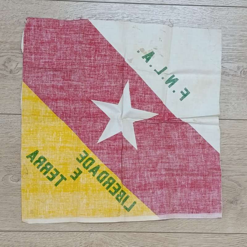 FNLA flag given to reaction force member by one of the original 32 troops
