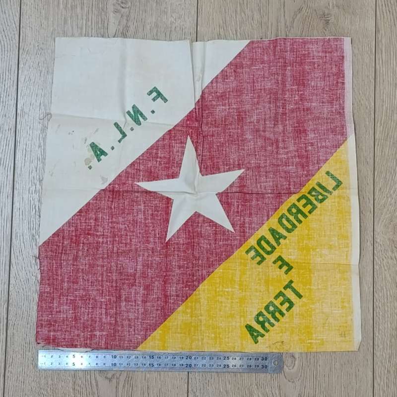 FNLA flag given to reaction force member by one of the original 32 troops