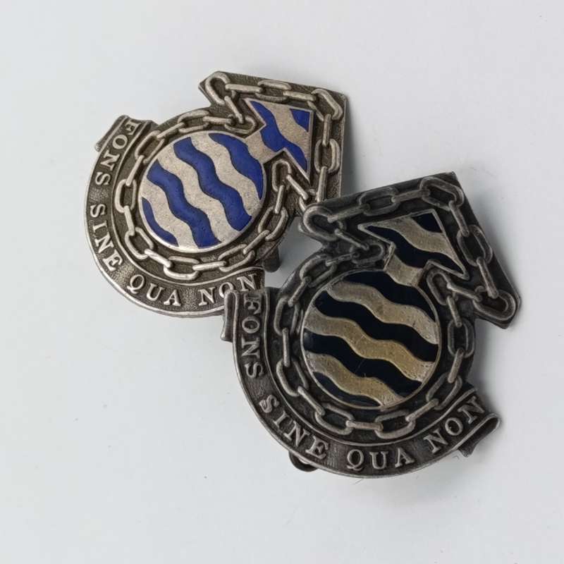 Lot of 2 different SA Ordnance services Corps cap badges