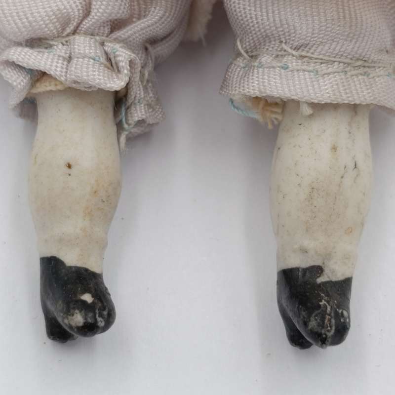 Antique blond hair rosy cheeks bisque doll - late 1800's - 17cm long