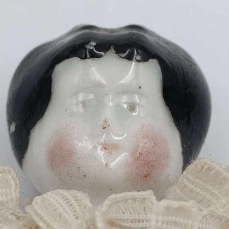 Dark hair rosy cheeks antique doll - 17cm long