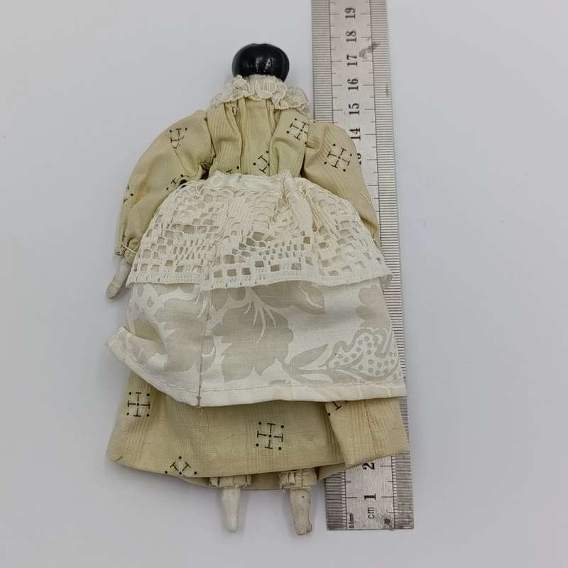 Dark hair rosy cheeks antique doll - 17cm long