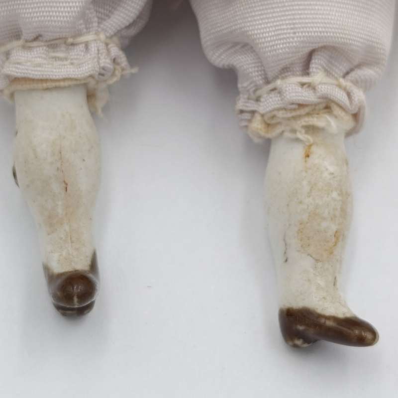 Dark hair rosy cheeks blue eyes antique doll - 19cm long - repaired hands