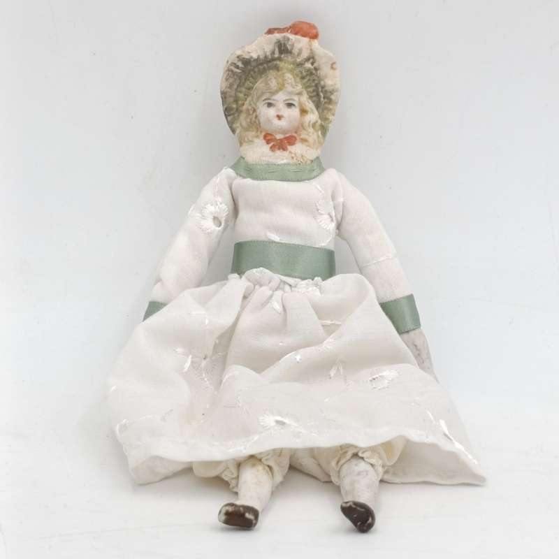 Antique Bisque doll 20cm long - hat chipped - late 1800's