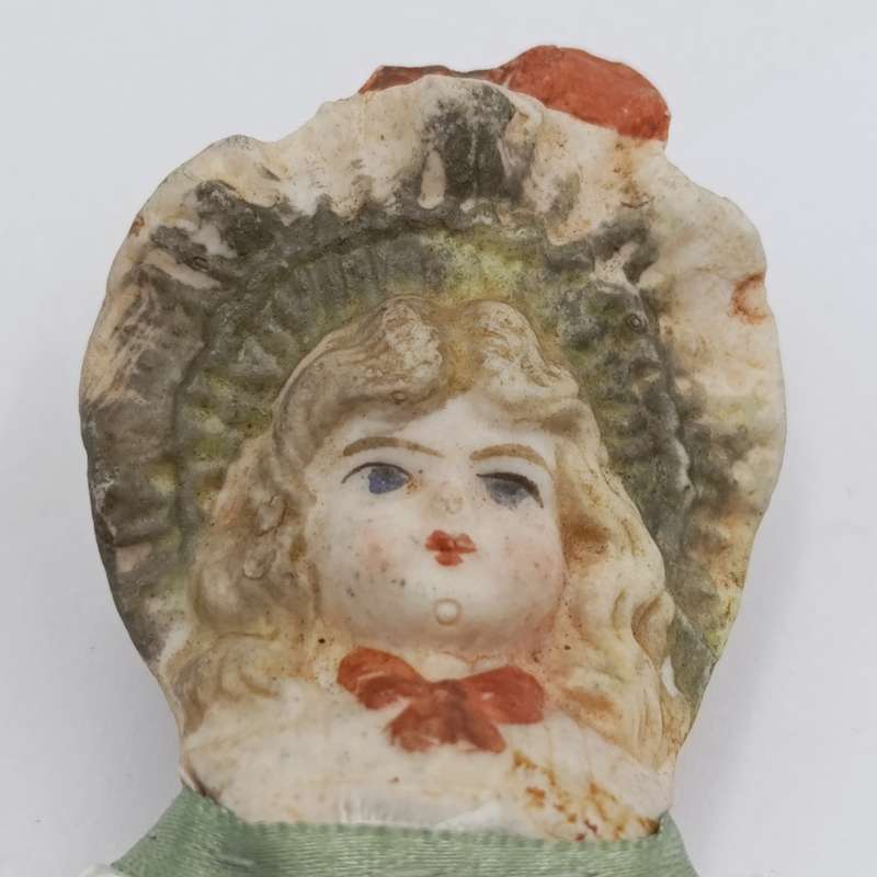 Antique Bisque doll 20cm long - hat chipped - late 1800's