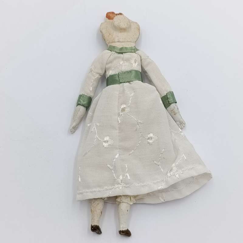 Antique Bisque doll 20cm long - hat chipped - late 1800's