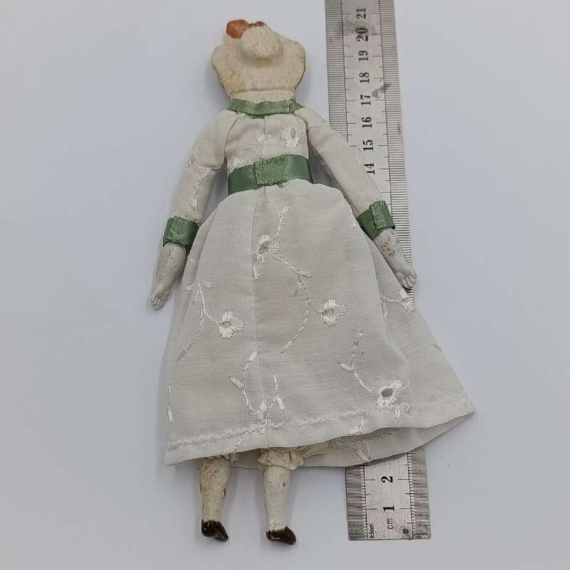 Antique Bisque doll 20cm long - hat chipped - late 1800's