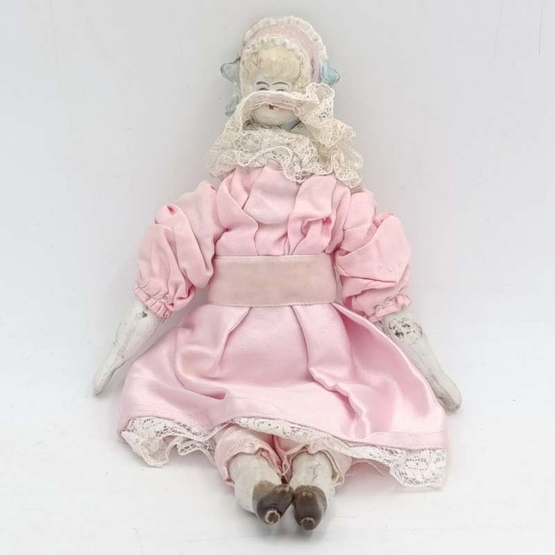 Bisque China head doll - 22cm high - chip on head - antique