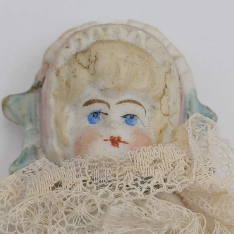 Bisque China head doll - 22cm high - chip on head - antique