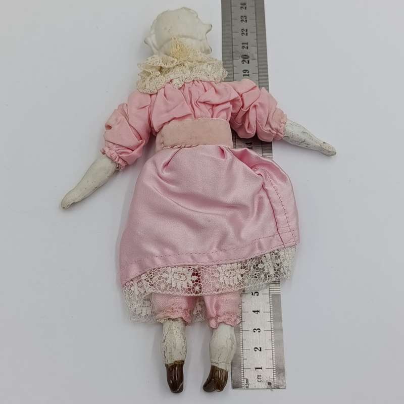 Bisque China head doll - 22cm high - chip on head - antique