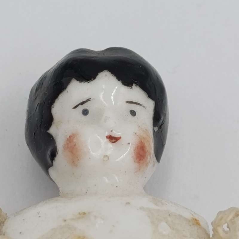 Late 1800's German dark hair rosy cheeks antique doll - 15cm long