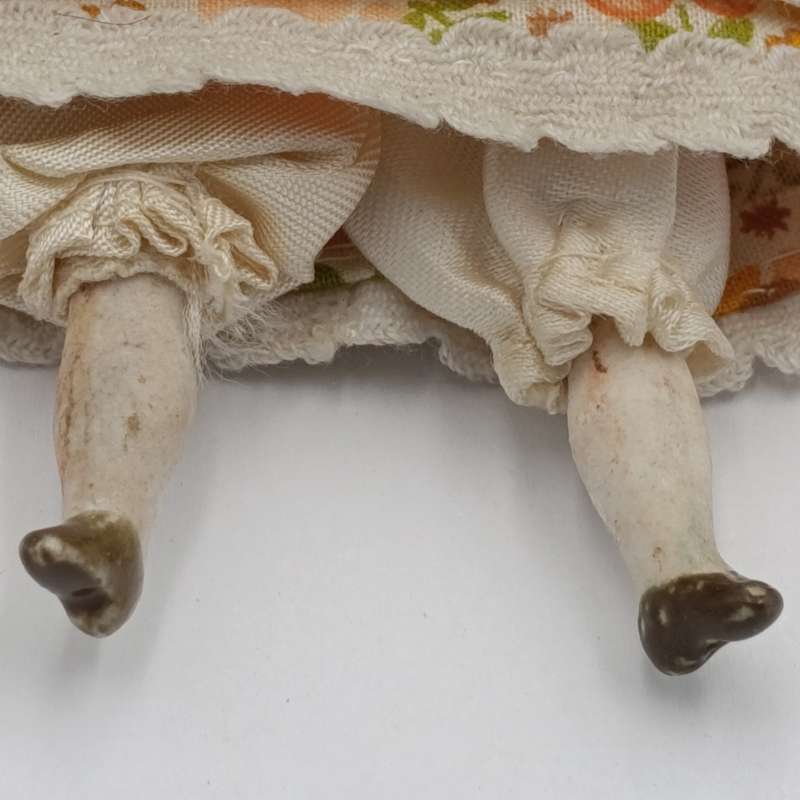 Late 1800's German dark hair rosy cheeks antique doll - 15cm long