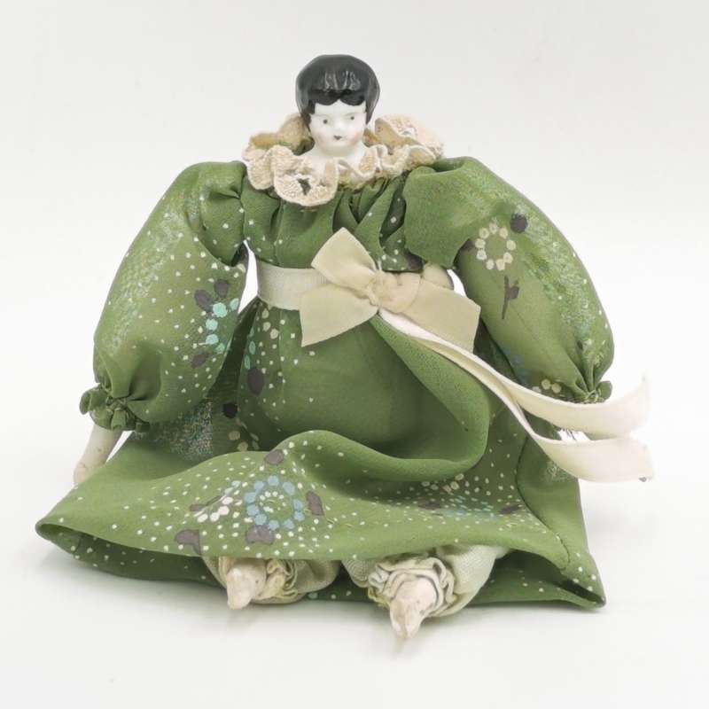 Dark hair rosy cheeks antique doll - 15cm long