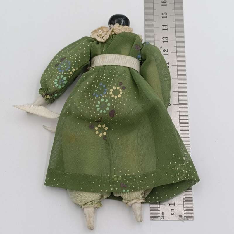 Dark hair rosy cheeks antique doll - 15cm long