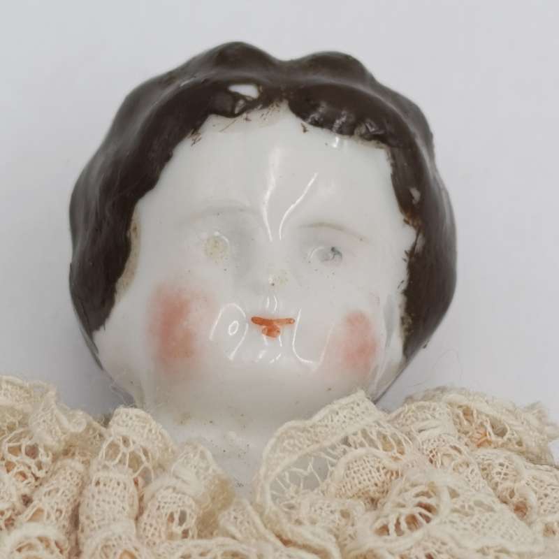 Antique brown hair rosy cheeks doll - 21cm long - late 1800's