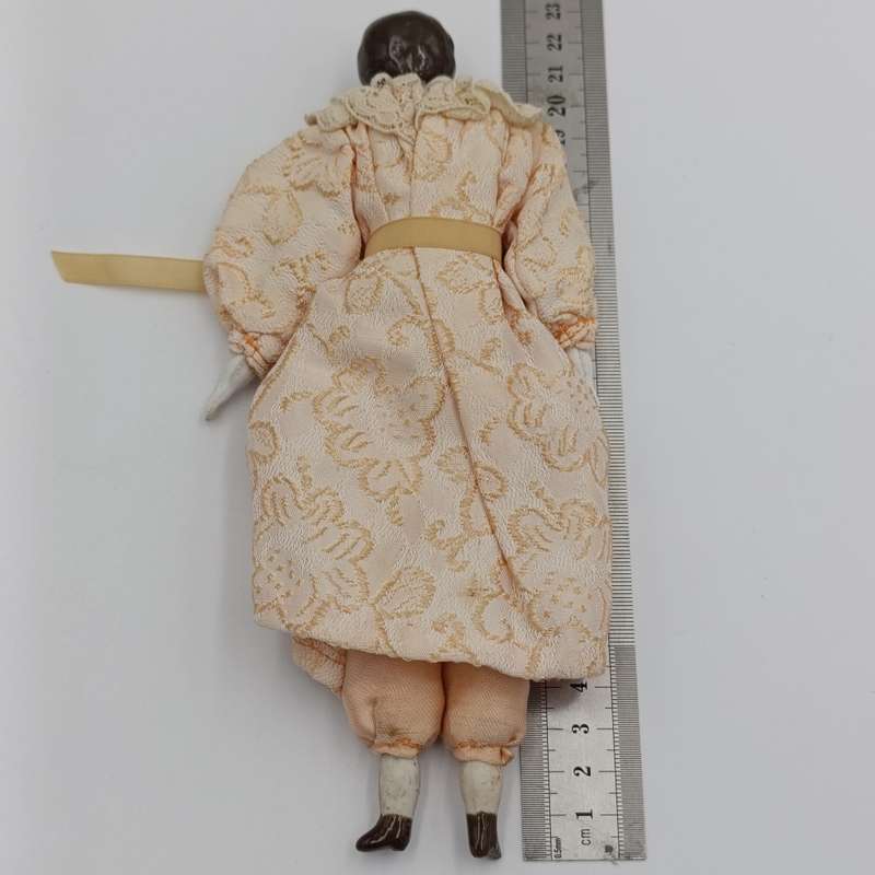 Antique brown hair rosy cheeks doll - 21cm long - late 1800's