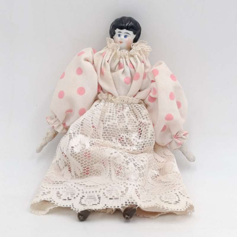 Antique blue eyes rosy cheeks dark brown hair doll - late 1800's - 21cm long