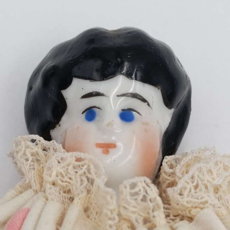 Antique blue eyes rosy cheeks dark brown hair doll - late 1800's - 21cm long