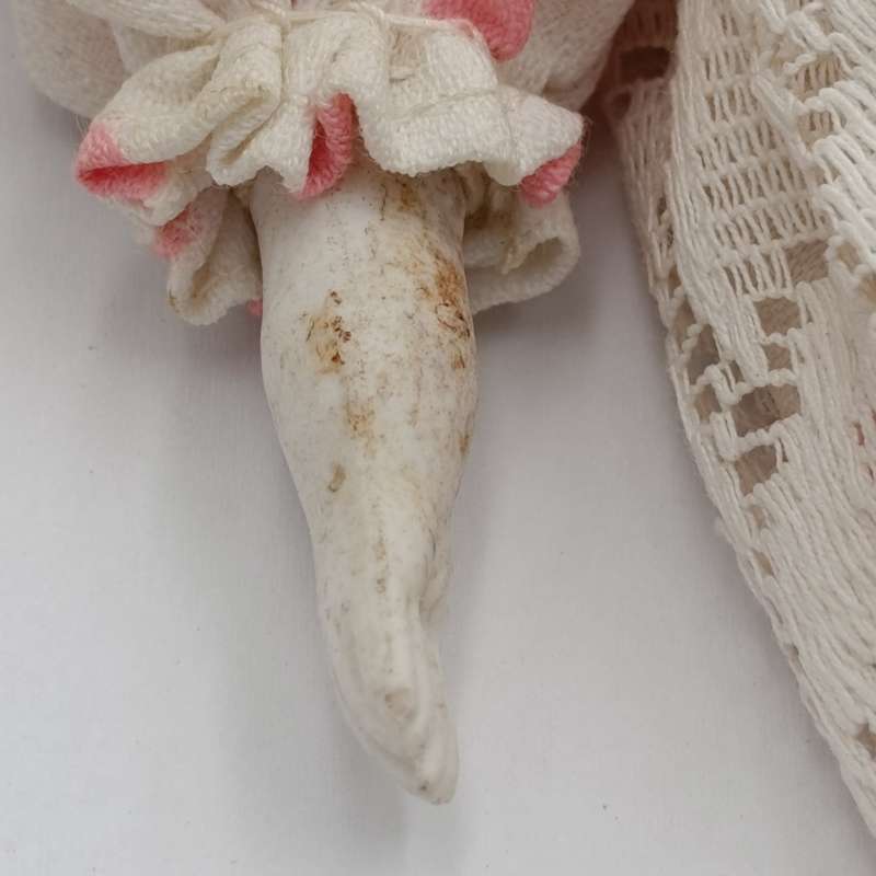 Antique blue eyes rosy cheeks dark brown hair doll - late 1800's - 21cm long