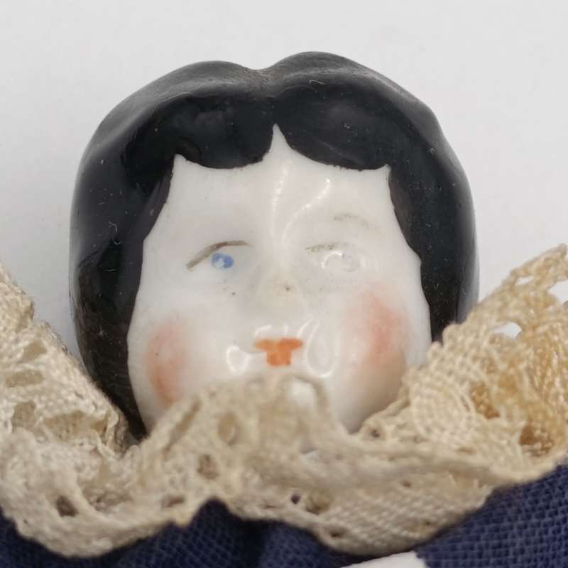 Dark hair rosy cheeks antique doll - 17cm long