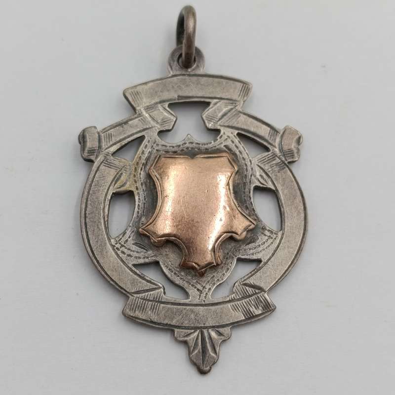 Antique Sterling silver medallion with gold top - issued to P Louw 1912 - weighs 8.4g