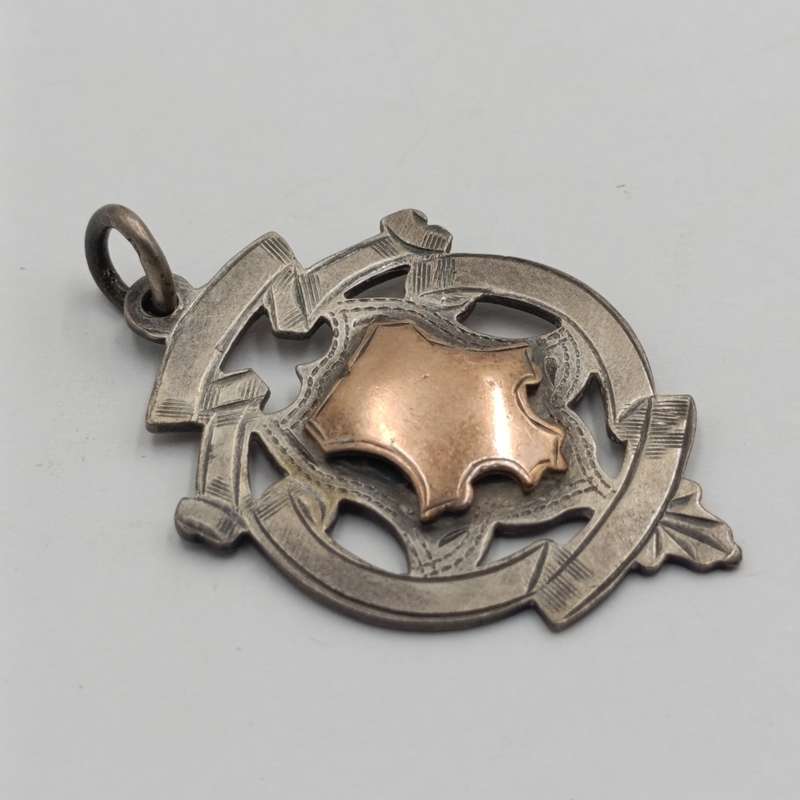 Antique Sterling silver medallion with gold top - issued to P Louw 1912 - weighs 8.4g
