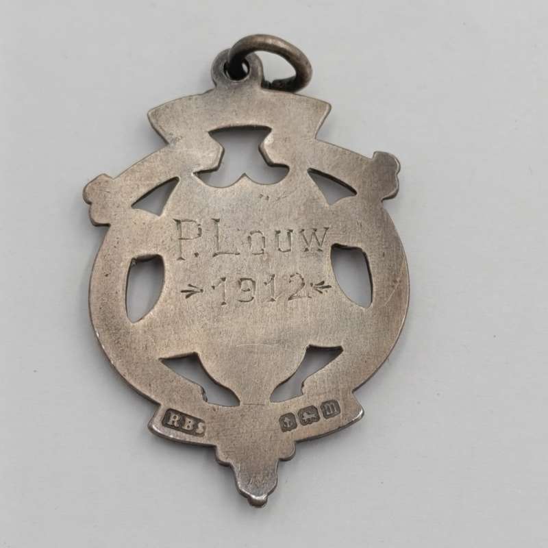 Antique Sterling silver medallion with gold top - issued to P Louw 1912 - weighs 8.4g