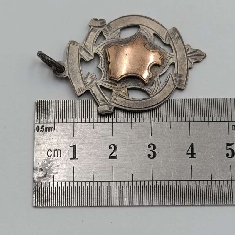 Antique Sterling silver medallion with gold top - issued to P Louw 1912 - weighs 8.4g