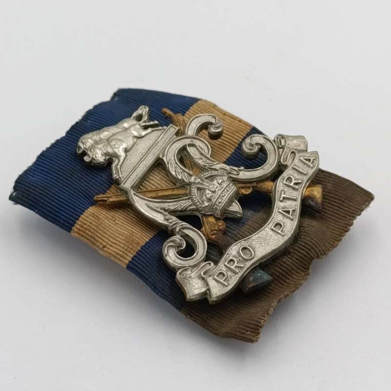 WW2 South Africa Natal Carbineers cap badge with cloth backing