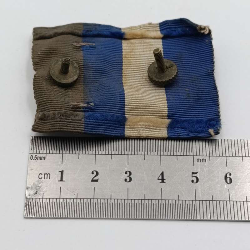 WW2 South Africa Natal Carbineers cap badge with cloth backing