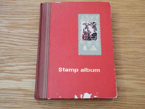 Stamp album with collection of international stamps as per photo