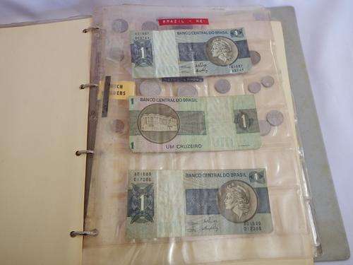Album with old international coins and bank notes