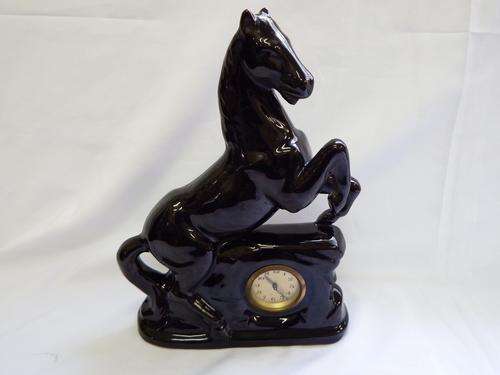 VIntage mantle clock with porcelain horse - working - but needs a service