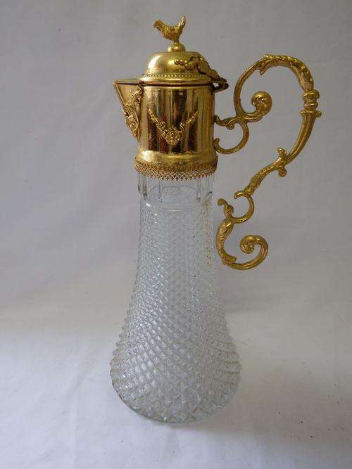 Vintage glass decanter with metal lid